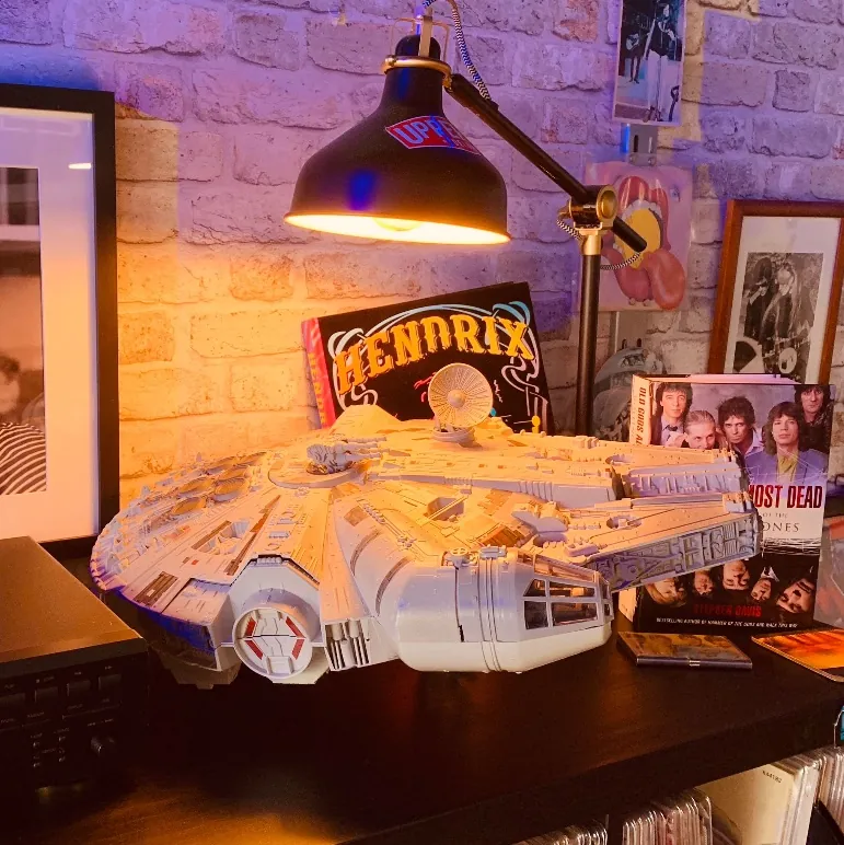 Model and vinyl records on a shelf inside the shop