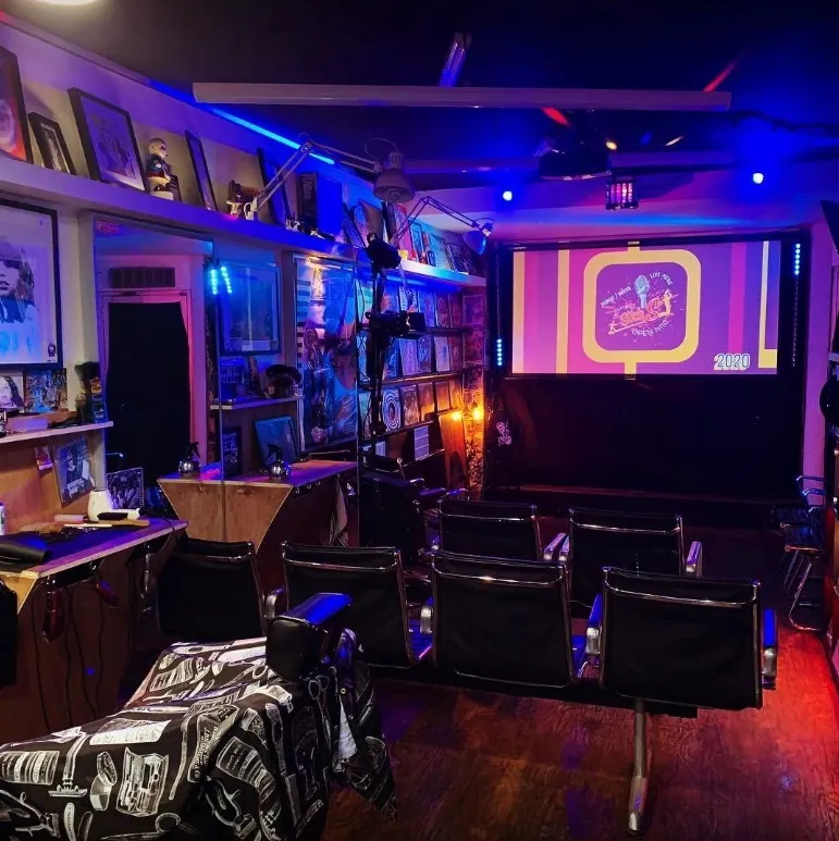 Barber chairs and vinyl wall inside Razorhead Barbers Bournemouth