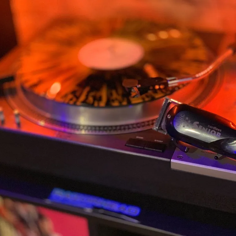 Clippers resting on a spinning turntable